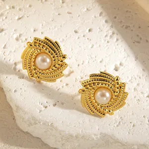 Vintage gold spiral round stud earrings with pearl center for an elegant look