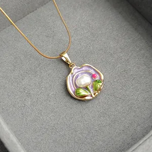 Gold snake chain necklace with purple enamel flower pendant and white baroque pearl