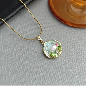 Exquisite gold snake chain necklace with light blue floral enamel pendant and white pearl