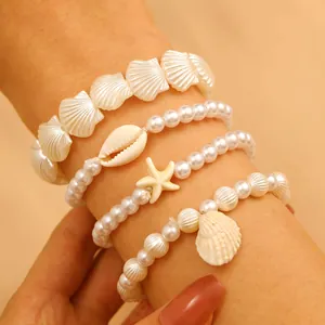 Set gioielli spiaggia boho con ciondoli a conchiglia e bracciali di perle a strati