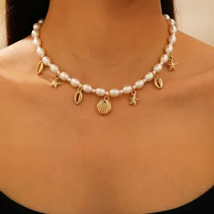 Collier bohème en perles avec pendentifs étoile de mer et coquillages dorés pour plage
