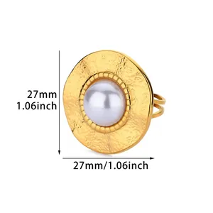 Macro shot of 27mm vintage gold ring with hammered texture and faux pearl detail