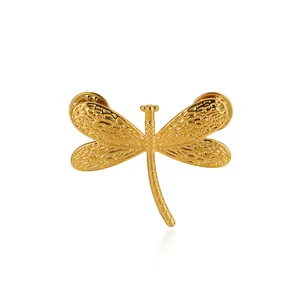 Vintage golden dragonfly brooch in titanium steel with textured wings and dual pin closure