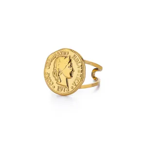 Detailed macro of vintage gold coin ring with embossed portrait and double band design