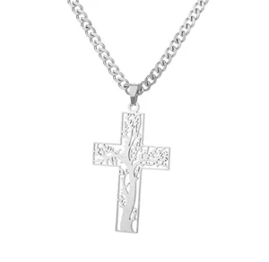 Close-up of stainless steel cross necklace with tree of life cutout and cuban chain