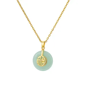 Macro detail of gold-plated O-chain necklace featuring a green jade Fu character pendant