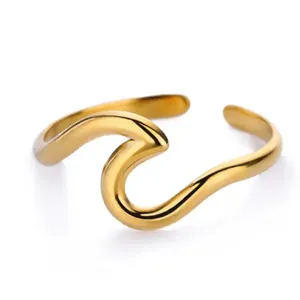 Minimalist 18K gold plated stainless steel wave ring with fluid irregular geometric design