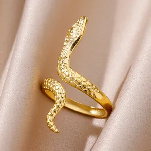 Macro shot of the 18K gold plated snake ring showing detailed scale textures on silk