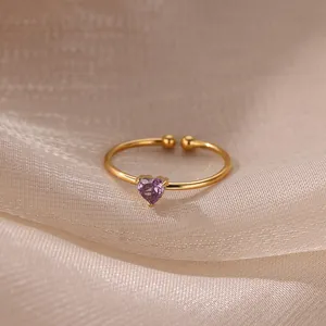 Macro detail of 18K gold-plated open ring featuring a purple heart zircon stone