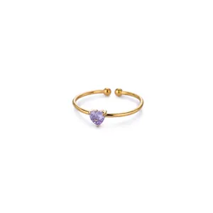 Detail of heart-shaped purple zircon on 18K gold-plated adjustable stainless steel ring