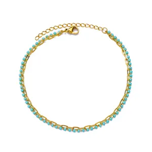 Detailed macro view of 18K gold plated chain with turquoise beads and lobster clasp