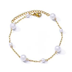 Detail of adjustable 18K gold plated anklet with white pearls and lobster clasp