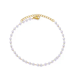 Close-up of pearl anklet with gold chain, lobster clasp, and extension links detail