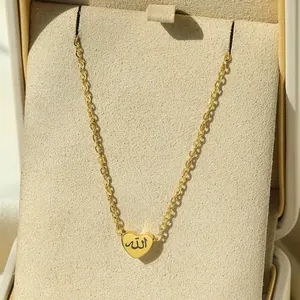 Detail of 18K gold plated heart pendant with Arabic Allah calligraphy in jewelry box