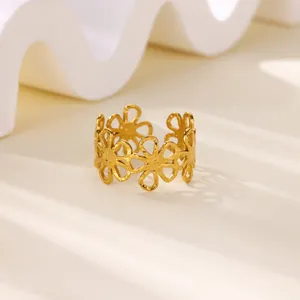 Minimalist gold cutout floral ring with hammered texture and adjustable open band design