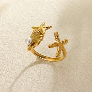 Golden 18k plated starfish and shell ring with pearl accent and open adjustable band