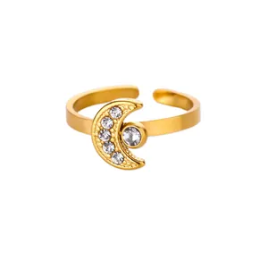Detail of adjustable gold ring with crescent moon and sparkling zircon stone setting
