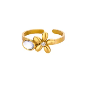 Detailed macro view of an adjustable gold sunflower ring with sparkling white zircon stones