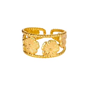 Detailed macro view of a gold-plated adjustable ring featuring intricate floral cutouts