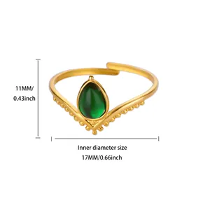 Detail view of a vintage V-shaped gold ring with a green teardrop stone and measurements