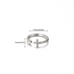 Detail view of silver ring with iced-out cross and heart design showing 17mm inner diameter