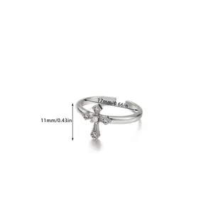 Detail view of silver adjustable cross ring with size measurements of inner diameter