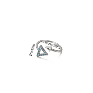 Detailed view of silver open ring with blue stone triangles and 18mm size measurements