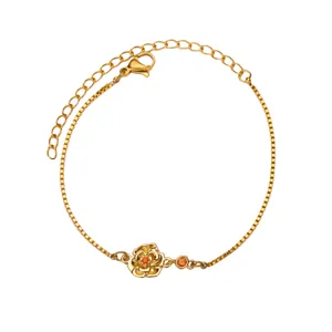 Bracelet fleur en titane doré avec pierre orange et fermoir mousqueton ajustable
