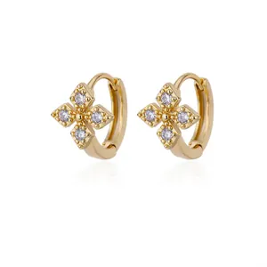 Golden clover earrings featuring sparkling round zircons with beaded petal edges