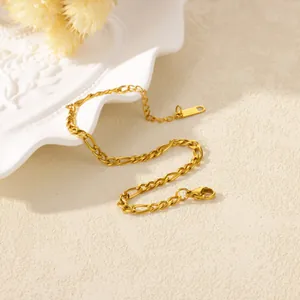 Detail of 18K gold-plated stainless steel Figaro chain bracelet with lobster clasp