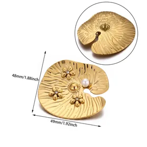 Detailed view of lotus leaf brooch with gold petals and white pearl, size 48mm x 49mm