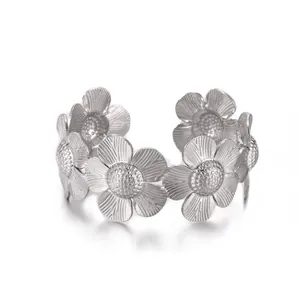 Detailed macro view of silver flower open bangle with textured sunflower petal craftsmanship