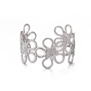 Elegant silver open bangle featuring hollow daisy flower patterns in minimalist style