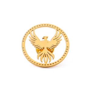 Polished golden eagle phoenix brooch with decorative circular frame and butterfly clasp