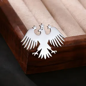Polished stainless steel eagle brooch with stars on wooden jewelry box display