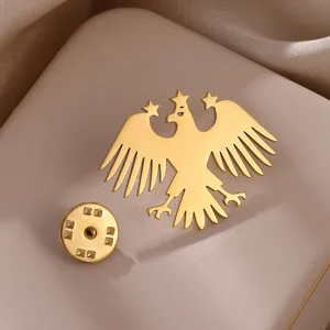 Polished gold bald eagle brooch pin with star accents for suits and jackets
