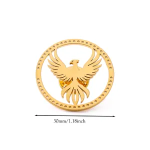 Macro shot of 30mm golden phoenix brooch in a circular frame with polished metal texture