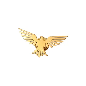 Close-up of golden eagle brooch featuring a butterfly clasp and polished metallic finish