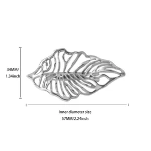 Detailed view of silver hollow monstera leaf brooch with precise 57mm width dimensioning