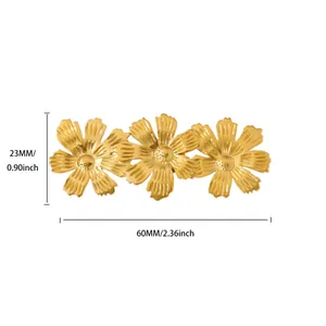 Detail view of golden triple flower brooch with size dimensions and petal texture
