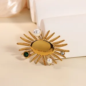 Elegant gold sunburst brooch with pearls, green gemstone and zircon, vintage style