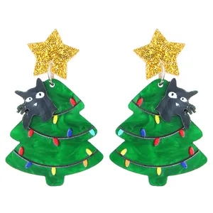 Cute acrylic Christmas tree earrings with star toppers and tiny black cats on white background