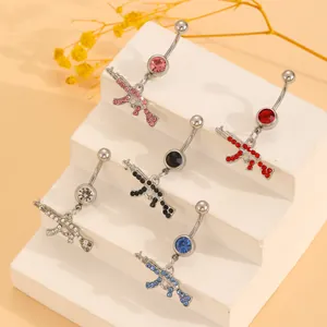 Five-piece AK47 gun shape belly rings set with multi-color rhinestones on white stand
