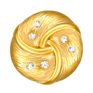 Detailed macro view of golden solar swirl pattern ring with sparkling zircon insets