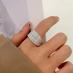 Chic multi-layered silver ring featuring textured thin wire coils for a modern stackable look