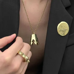 Close-up of vintage gold Sun Wukong jewelry set with crown necklace and ring