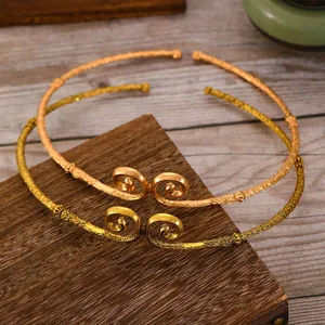 Close-up of Ruyi Jingu Bang collar with traditional cloud patterns and bronze finish