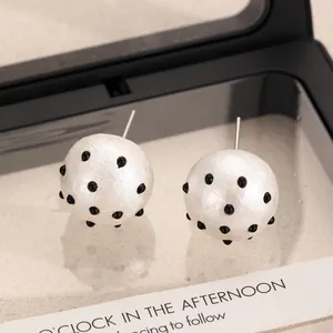Vintage pearl white ball earrings with black 3D polka dots in a clear gift display box