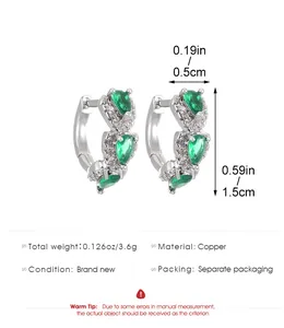 Detail view of heart-shaped emerald zircon earrings with size and weight dimensions