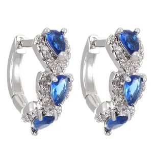 Silver hoop earrings with three pear-shaped blue zircons and white pave settings